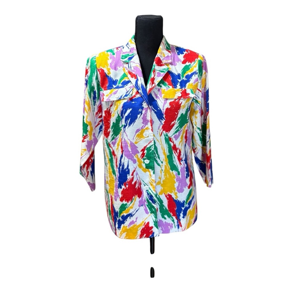 Women's jacket with vibrant, multi-colored abstract/brushstroke pattern.